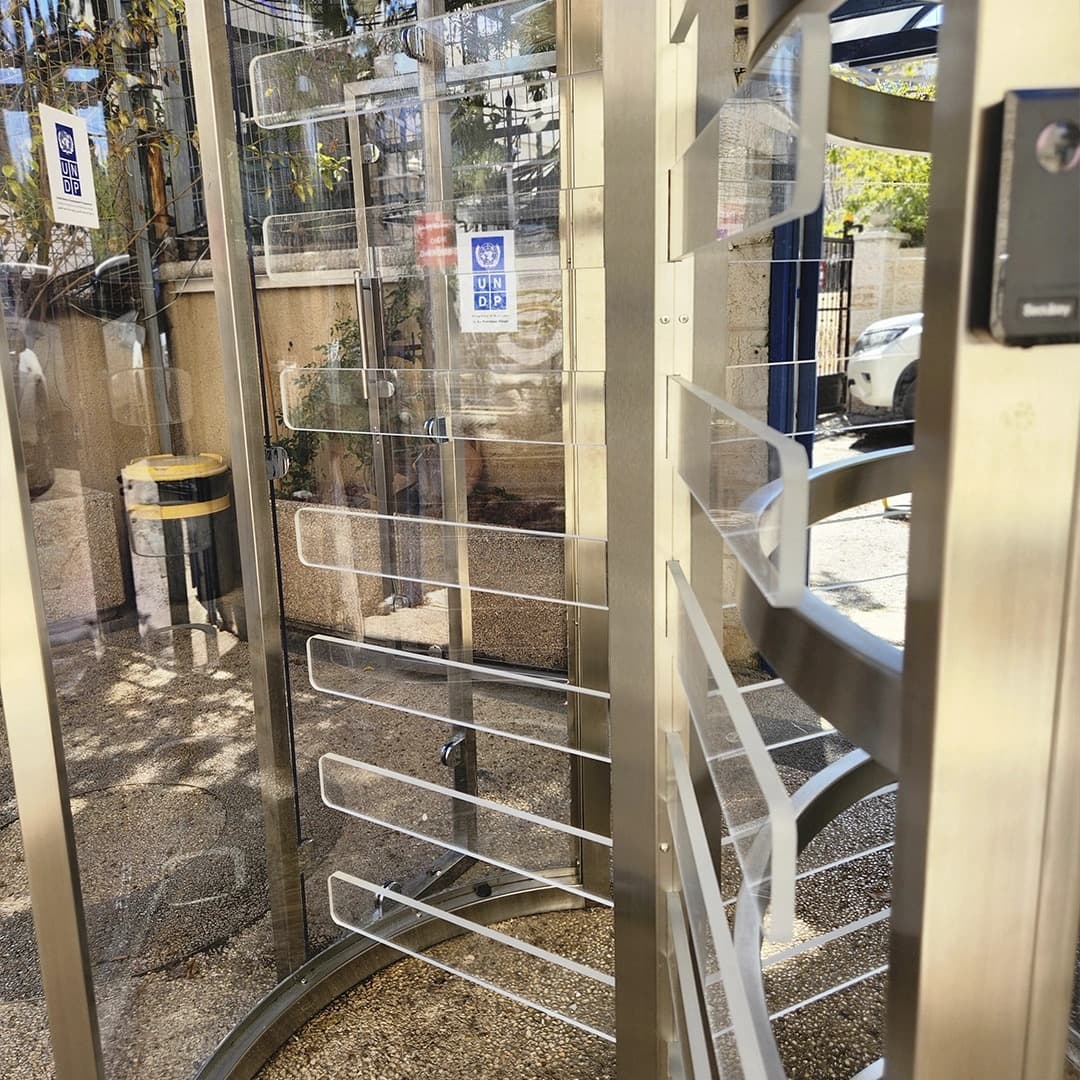 Gatestile Glass Rotating Turnstile in a corporate mantrap entry setting, deployment visualization